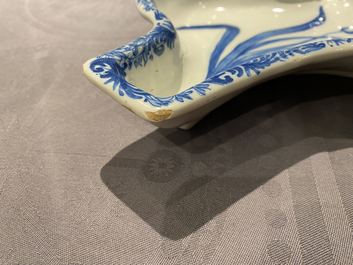 A pair of Dutch Delft blue and white carnation flower dishes, 18th C